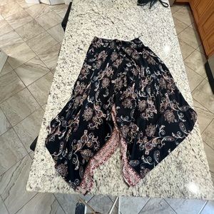 Lola P elastic waist large skirt. Shorter in the front and long on the sides.